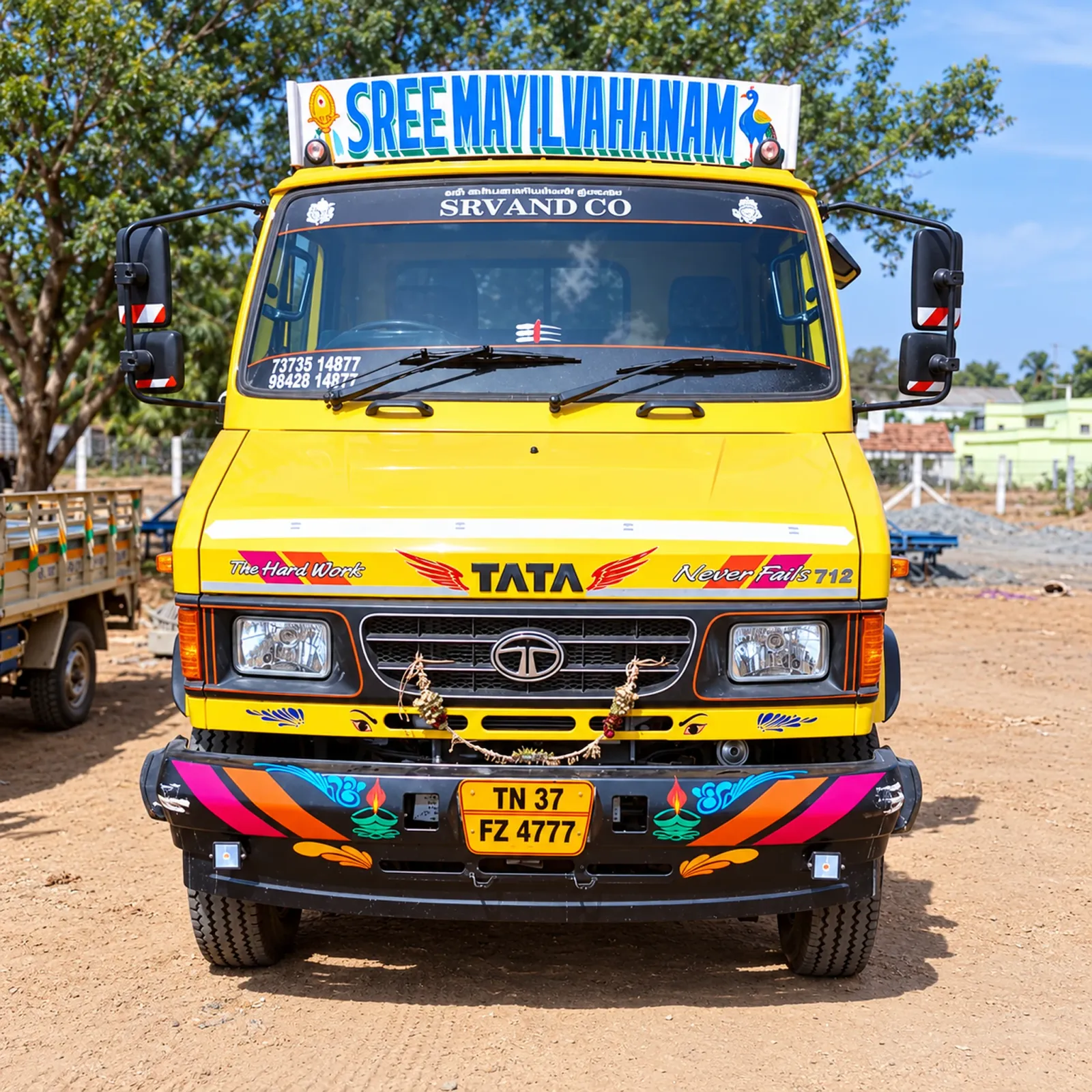 SRV AND CO yellow Tata truck with Sree Mayil Vahanam branding