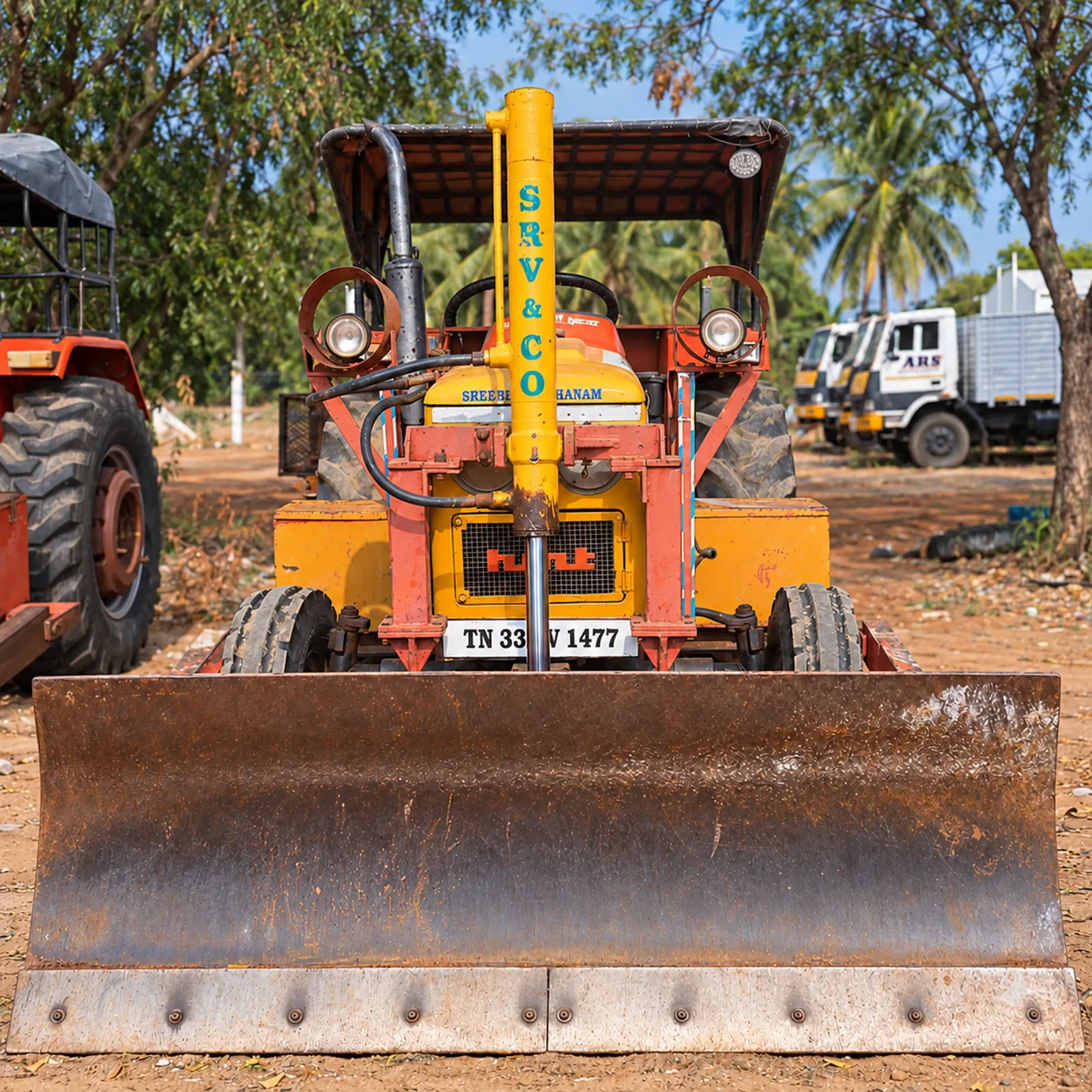 SRV AND CO tractor fitted with a front dozer blade