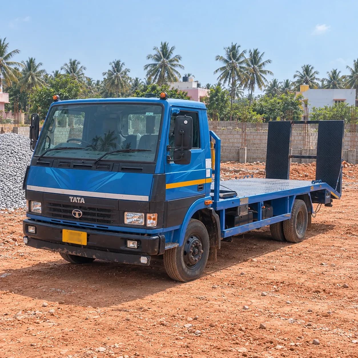 Representative image of an Indian flatbed recovery truck in a Tamil Nadu yard